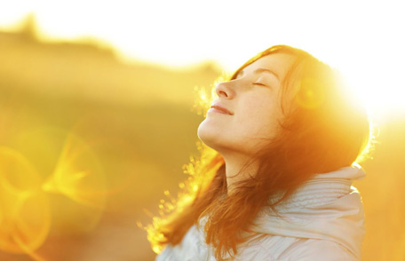 naturopathic healthcare woman enjoying sunshine